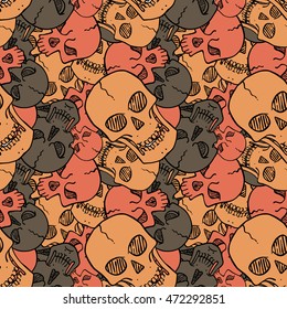 Vector seamless pattern with random skulls. Scary design.