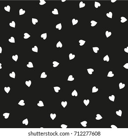 Vector seamless pattern. Randomly disposed hearts. Cute background for print on fabric, paper, scrapbooking. Modern graphic design. Hipster creative tileable print