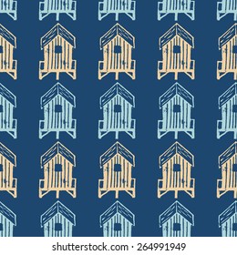 Vector seamless pattern of real linocut hand printed beach huts on dark blue indigo background