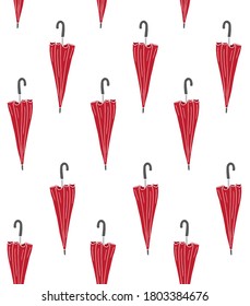 Vector seamless pattern of red colored hand drawn doodle sketch umbrella isolated on white background