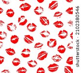 Vector seamless pattern of red kissing lips stamps randomly scattered on white background.
