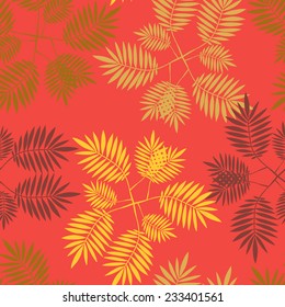 Vector seamless pattern with  red, orange and yellow tropical leaves on red background. Seamless decorative template texture with leaves. Endless leaf background. 