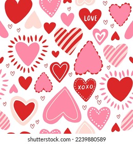 Vector seamless pattern with red and pink hearts. Freehand doodle drawing for valentines day. Can be used on packaging paper, fabric, background for different images, etc.