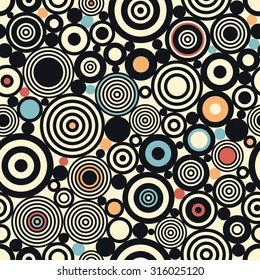 Vector seamless pattern. Repeating color geometric tiles with dots, rings and circles.
