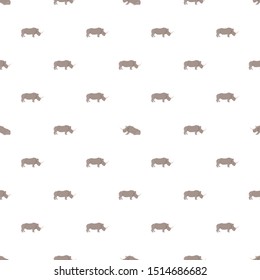 Vector seamless pattern with rhinos on white background