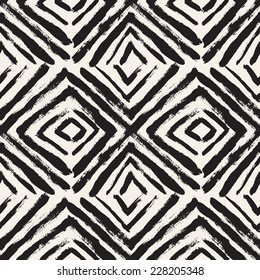 Vector seamless pattern with rhombuses. Abstract background  made using of brush smears. Monochrome hand drawn texture