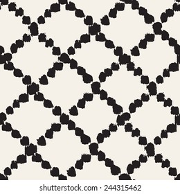 Vector seamless pattern with rhombuses. Abstract background made using of brush smears. Monochrome hand drawn texture