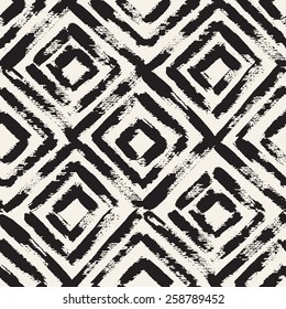 Vector seamless pattern with rhombuses. Abstract background made using of brush smears. Monochrome hand drawn texture. Trendy hipster print. Modern graphic design.