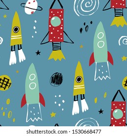 Vector seamless pattern with rocket, planets and stars. Seamless vector texture for baby design. Seamless pattern with cartoon space adventure, planets and stars.