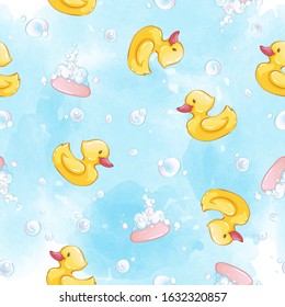 Vector seamless pattern with rubber yellow ducklings, pink soap and bubbles on a blue watercolor background. Children's backdrop.