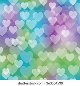 Vector seamless pattern with shiny hearts bokeh on blurred soft background. Valentine's day background. Hearts pattern on colorful background
