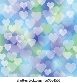 Vector seamless pattern with shiny hearts bokeh on blurred soft background. Valentine's day background. Hearts pattern on colorful background
