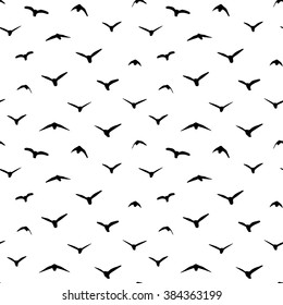 Vector seamless pattern with silhouette of birds on a white background