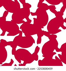 Vector seamless pattern of silhouette rabbits in red color on white background. Graphic red rabbits for the paper wrap, backdrop, and fashion textile. Isolated design on white background.