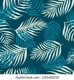 Vector seamless pattern of silhouettes palm leaves dypsis lutescens. Tropical background perfect for print, fabric, wrapping paper, wallpaper, etc