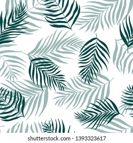 Vector seamless pattern of silhouettes palm leaves dypsis lutescens. Tropical background perfect for print, fabric, wrapping paper, wallpaper, etc