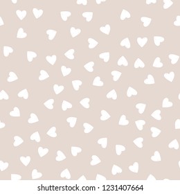 Vector seamless pattern. Simple hipster background with hand drawn white hearts.