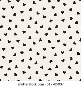 Vector seamless pattern. Simple repeating texture with chaotic hearts. Stylish hipster texture.