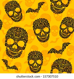 Vector seamless pattern with skulls and bats. Happy Halloween background