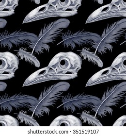 Vector seamless pattern with skulls and raven feathers. Black and white.

