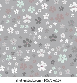 Vector seamless pattern with small delicate flowers on grey background for fabric, scrapbook