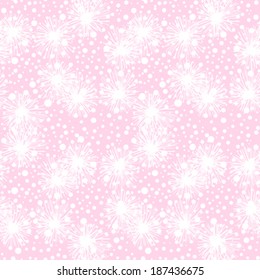 Vector seamless pattern with small furry flowers, pompoms or snowflakes in white color on a soft pink background