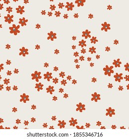 Vector seamless pattern with small pretty red flowers on beige backdrop. Liberty style millefleurs. Simple floral background. Elegant ditsy ornament. Repeat design for decor, textile, wallpaper, print