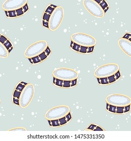 Vector seamless pattern with snare drums. Сlassical percussion musical instruments. Violet and golden colors. Isolated objects.  Mint background. 