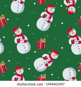 Patrón vectorial sin fisuras con hombres de nieve y copos de nieve sobre un fondo verde. Ideal para papeles pintados, papel de envoltura, tela, fondos de sitios web, tarjetas de Navidad.