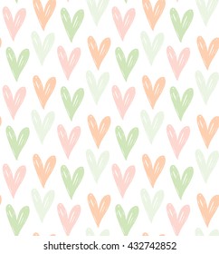 Vector seamless pattern with soft colored hand drawn hearts.