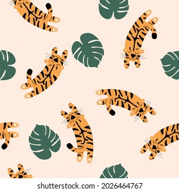 Vector seamless pattern with spotted chinese tigers.  Tigers on a beige background are jumping into palm leaves.  Wildlife and fauna, Vector flat illustration.  A family of felines or carnivores.