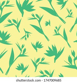 Vector seamless pattern. Seamless strelitzia flower pattern. Green tropical flowers isolated on yellow background. Strelitzia, bird of paradise, crane lily. Design for fashion textile, wallpapers.
