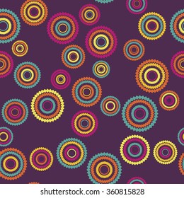 Vector seamless pattern. Stylish textile print with bright geometric design. Colorful fabric background with chaotic round ornaments.
