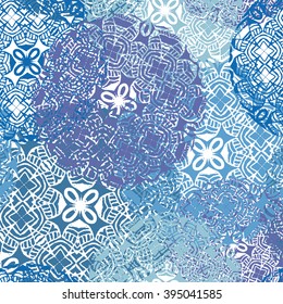 Vector seamless pattern with stylized mandalas and flowers in pastel blue colors. 