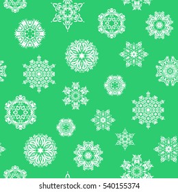 Vector seamless pattern with stylized snowflakes. Snowflakes pattern in green colors.