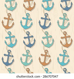 Vector seamless pattern. Summer sea background colorful anchors with rope on a wooden boards background.