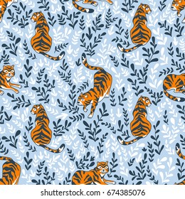 Vector seamless pattern with tigers isolated on the floral background. Animal background for fabric or wallpaper boho design.