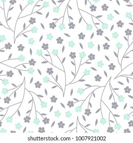 Vector seamless pattern of tiny mint and grey cherry blossom flowers on branches. Great for home decor fabrics, children's textiles and gardening products.