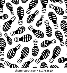 Vector seamless pattern with traces of shoes on a white background