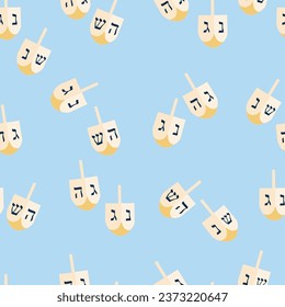 Vector seamless pattern with traditional Jewish spinning top Dreidel on a light blue background