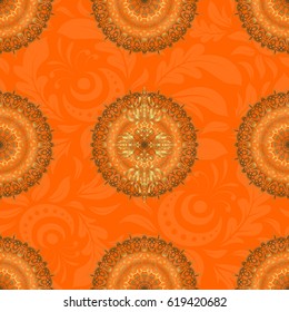 Vector seamless pattern of traditional ornamental background with golden circular mandala, stars and snowflakes elsments on a orange backdrop.