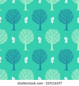 Vector seamless pattern with tree silhouette and leafs in turquoise and white colors for fall winter fashion or Christmas wrapping paper. Chic, elegant, natural print with woods. Retro style wallpaper