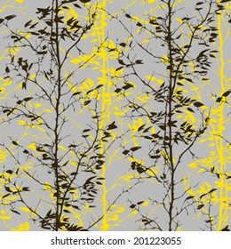 Vector seamless pattern with trees silhouettes with falling leaves in black, grey and yellow colors for fall winter fashion or thanksgiving wrapping paper