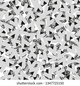 Vector seamless pattern. Trendy texture with a jumble of lines and triangle. Abstract geometric background