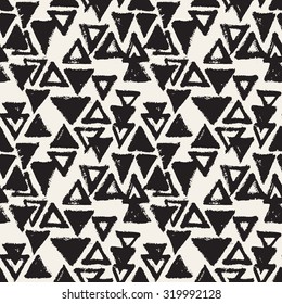 Vector seamless pattern with triangles. Abstract modern background. Monochrome texture from brush strokes. Hipster stylish design.