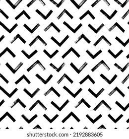 Vector seamless pattern with triangular lines. Ethnic or tribal chevron ornament zig zag and triangular brush strokes. Geometric textured grunge pattern for wallpaper, fabric print, wrapping paper. 