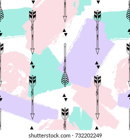 Vector seamless pattern with tribal arrows, triangles and brush painted elements. Boho style