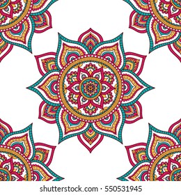 Vector seamless pattern with tribal mandala. Ethnic background with doodle ornament. On white backdrop. Red, green, white and yellow colors.