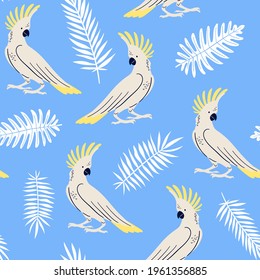 Vector seamless pattern with tropical fern, palm leaves and parrots. Umbrella cockatoo. Summer illustration on blue background