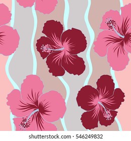 Vector seamless pattern of tropical hibiscus flowers in red and pink colors with watercolor effect.